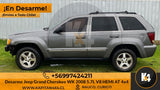 Vista lateral de Jeep Grand Cherokee WK 2008 gris en desarme de kapitan4x4 con llantas de aleación y barras de techo